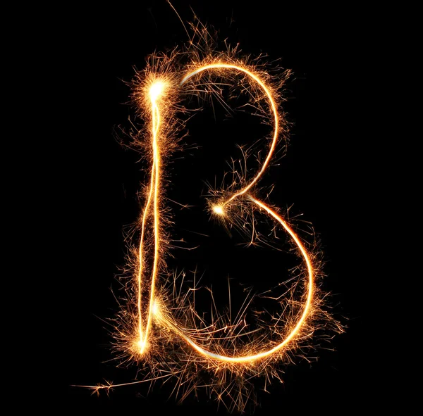 Letter "B" sparklers on black background — Stock Photo, Image