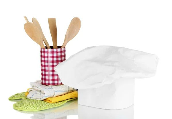 Chef's hat with kitchen towels, potholders and kitchenware isolated on white — Stock Photo, Image