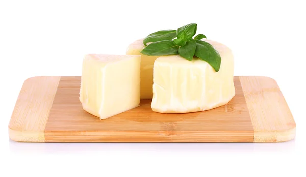 Cheese mozzarella and basil on cutting board isolated on white — Stock Photo, Image