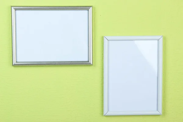 Photo frames on wall background — Stock Photo, Image