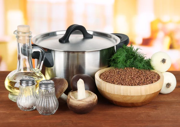 Ingredients for cooking buckwheat on table in kitchen — Stock Photo, Image