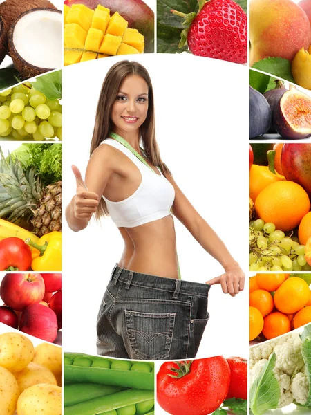 Beautiful young woman with big jeans among vegetables and fruits — Stock Photo, Image