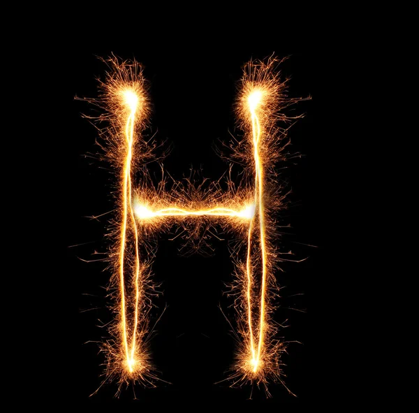 Buchstabe "h" Wunderkerzen auf schwarzem Hintergrund — Stockfoto