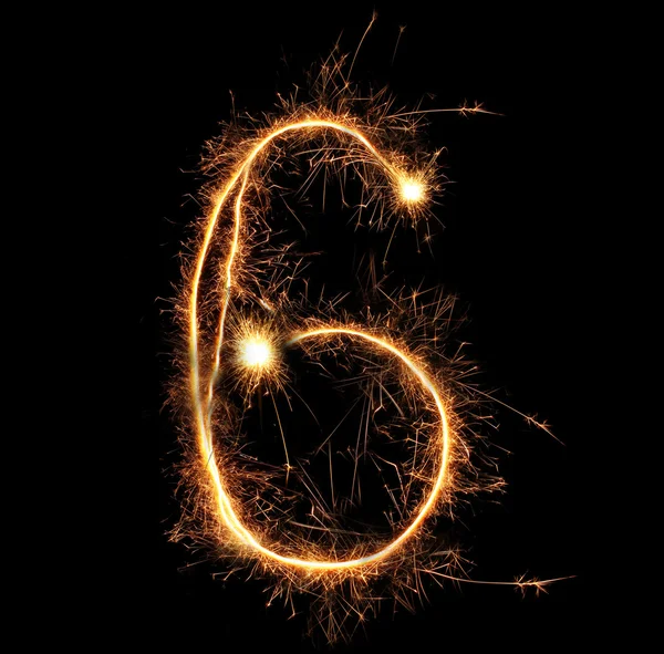 Number "six" sparklers on black background — Stock Photo, Image