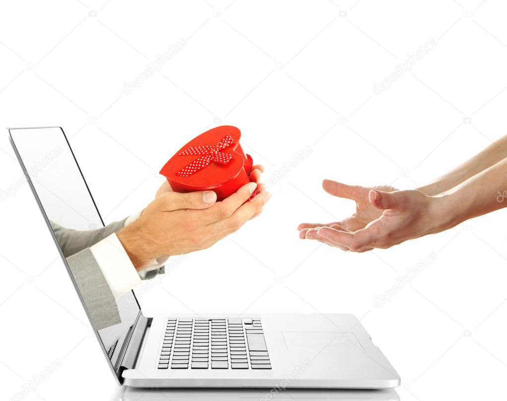 Male hand giving gift box to woman from laptop screen isolated on white