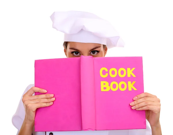 Portrait of young woman chef with cook book isolated on white — Stock Photo, Image