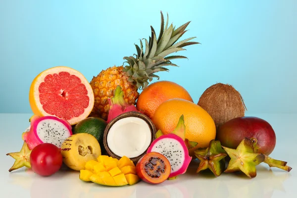 Composition of exotic fruits on blue background — Stock Photo, Image