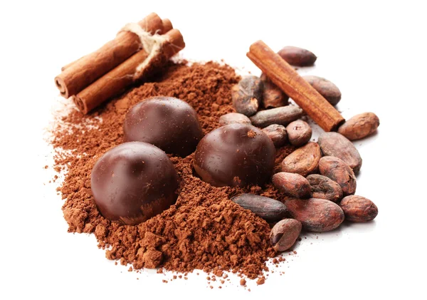 Composition of chocolate sweets, cocoa and spices, isolated on white — Stock Photo, Image