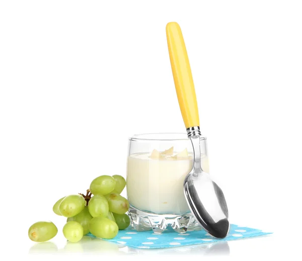 Delicious yogurt in glass with grapes isolated on white — Stock Photo, Image