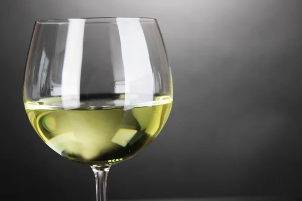White wine glass on grey background — Stock Photo, Image