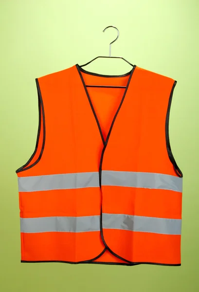 Orange vest, on color background — Stock Photo, Image