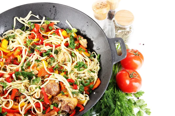 Noodles with vegetables on wok isolated on white — Stock Photo, Image