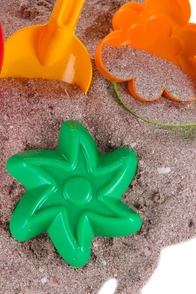 Kinderspeelgoed op zand close-up — Stockfoto