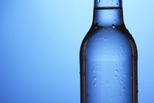 Water bottle on blue background — Stock Photo, Image