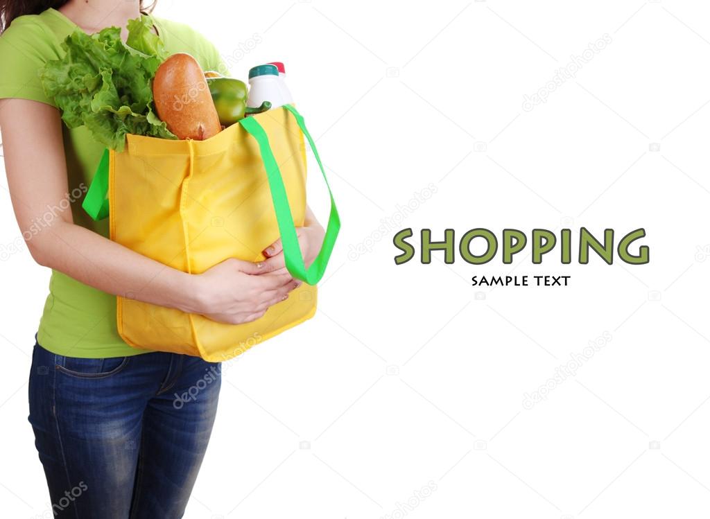 Girl with shopping bag isolated on white