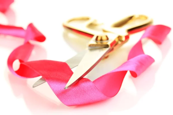 Satin ribbon curled around scissors isolated on white — Stock Photo, Image