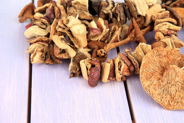 Dried mushrooms on wooden background — Stock Photo, Image