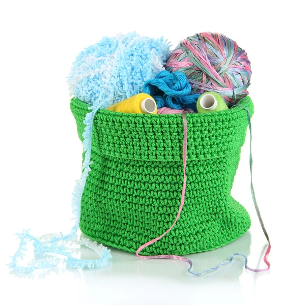 Colorful yarn for knitting in green basket isolated on white — Stock Photo, Image