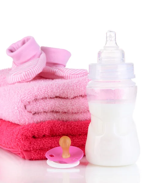 Bottle for milk with towels and nipple isolated on white — Stock Photo, Image