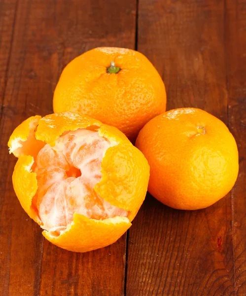 Tasty mandarines on wooden background — Stock Photo, Image