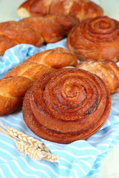Composition with buns, on color napkin, close up — Stock Photo, Image