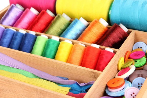 Colorful threads for needlework in wooden box close up — Stock Photo, Image