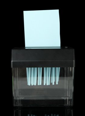 Paper shredder machine, isolated on black clipart