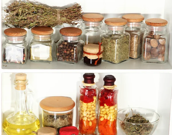 Variety spices on kitchen shelves close-up — Stock Photo, Image