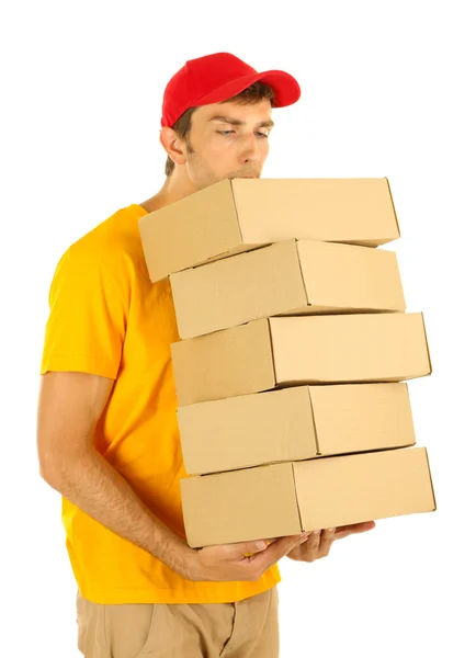 Jovem homem de entrega segurando parcelas, isolado em branco — Fotografia de Stock