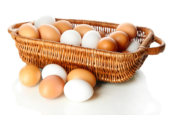 Many eggs in basket isolated on white