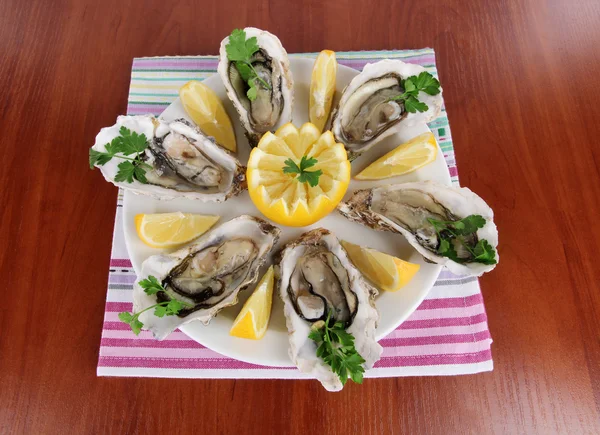 Oysters on wooden background — Stock Photo, Image