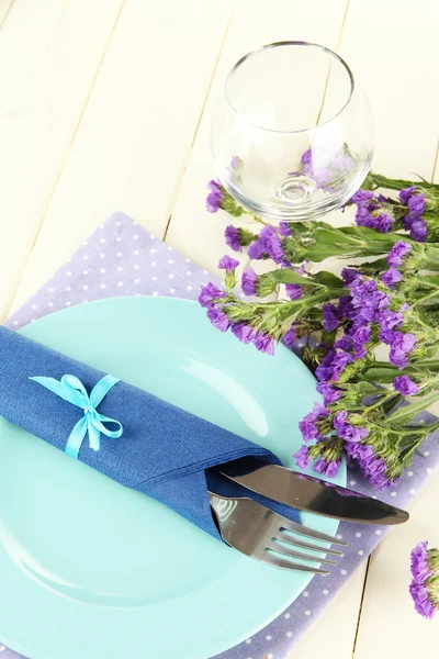 Table serving on a wooden background — Stock Photo, Image