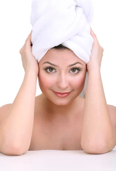 Beautiful young woman with towel on her head isolated on white — Stock Photo, Image