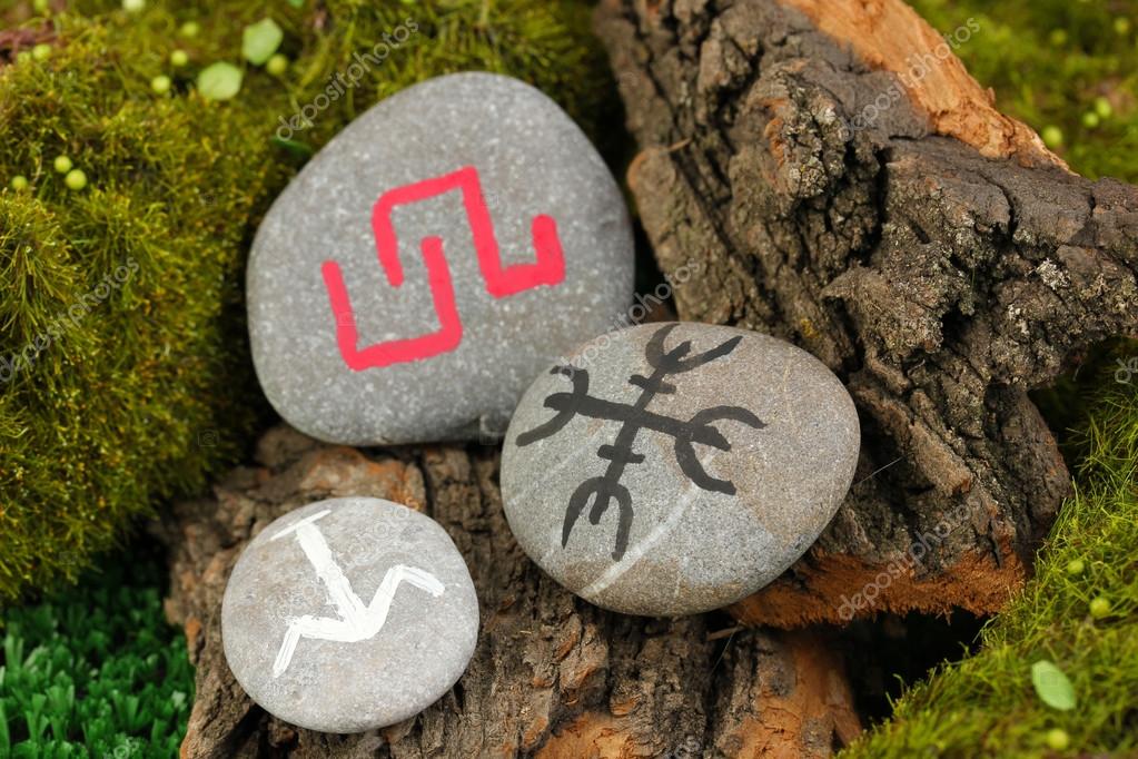 Fortune telling with symbols on stone close up — Stock Photo