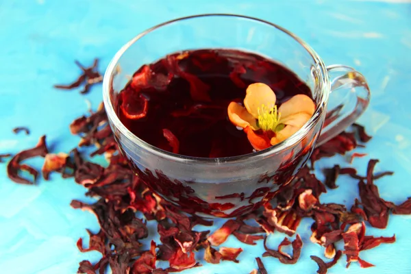 Herbal tea in glass cup, on color wooden background — Stock Photo, Image