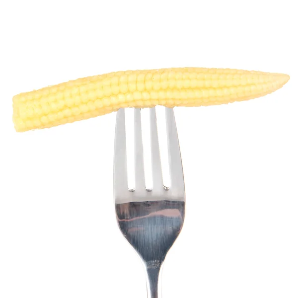 Bebé de maíz pegado en tenedor, aislado en blanco —  Fotos de Stock