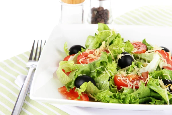 Light salad on plate on napkin — Stock Photo, Image