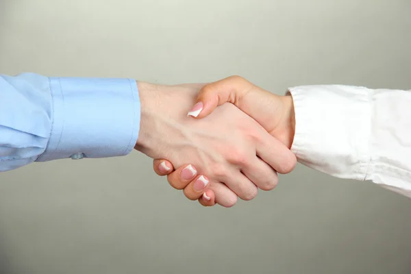 Business handshake on gray background — Stock Photo, Image