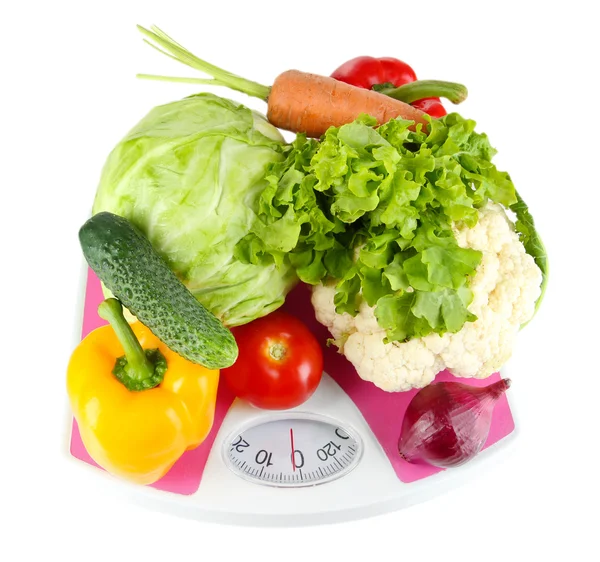 Fresh vegetables on scales on grey background — Stock Photo, Image