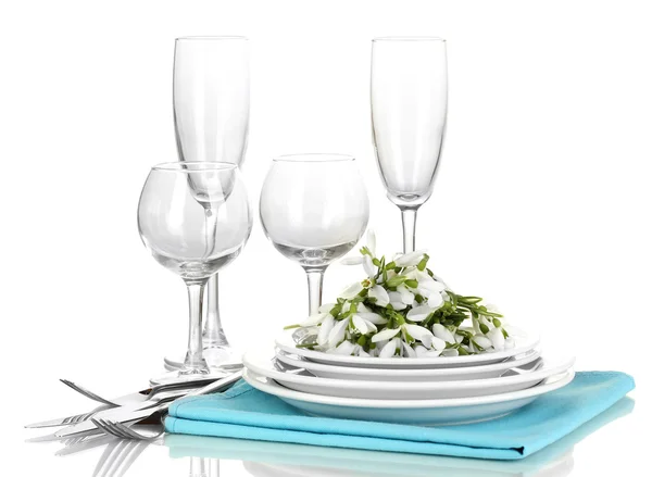 Serving dishes and snowdrops isolated on white — Stock Photo, Image