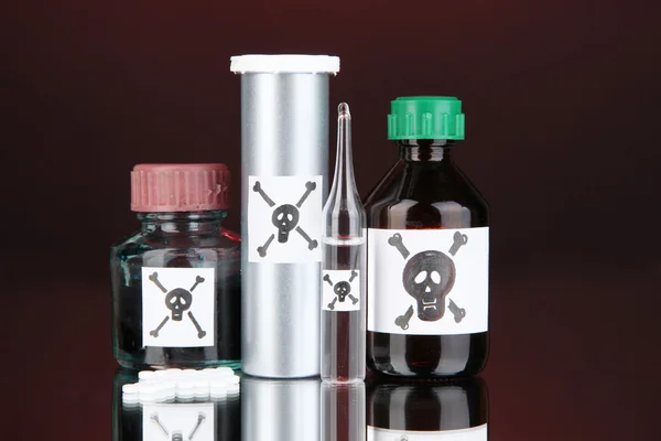 Deadly poison in bottles on black background — Stock Photo, Image