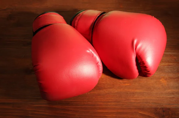 Boxing gloves on wooden background — Stock Photo, Image