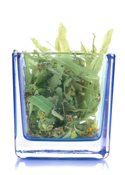 Sušené byliny ve skleněné nádobě izolované na bílém — Stock fotografie