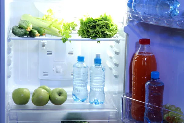 Open refrigerator with vegetarian food — Stock Photo, Image