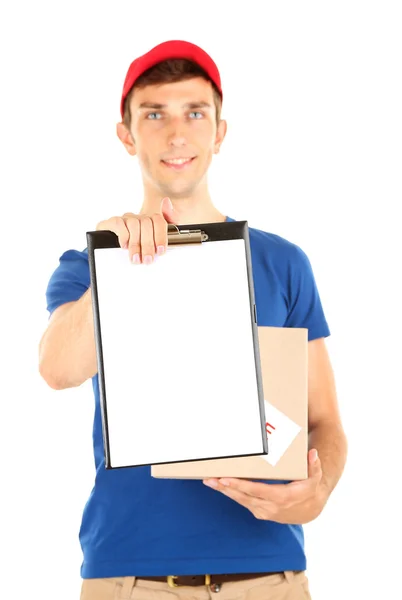 Young delivery man holding parcel and clipboard, isolated on white — Stock Photo, Image