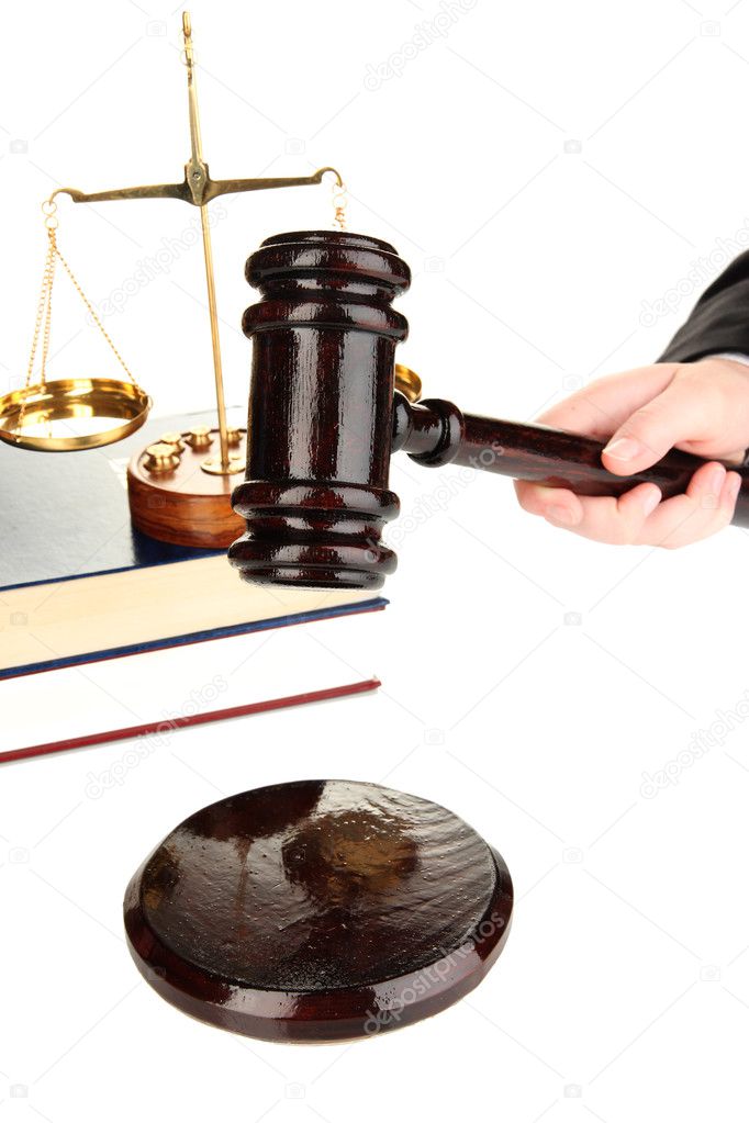 Judge's gavel in hand isolated on white