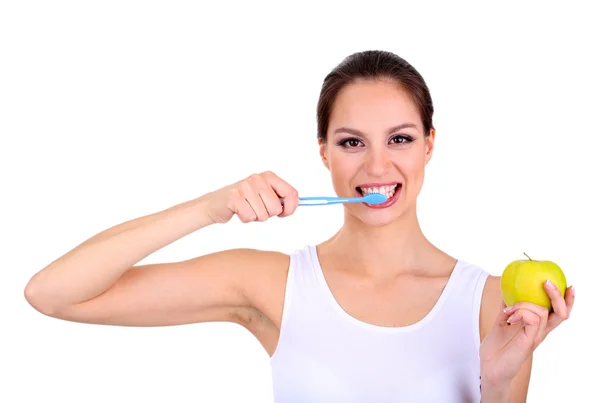 Mujer sonriente con manzana y cepillo de dientes aislados en blanco — Foto de Stock