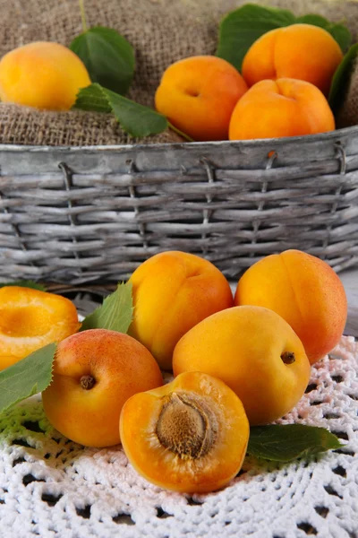 Apricots in basket on napkin close-up — Stock Photo, Image