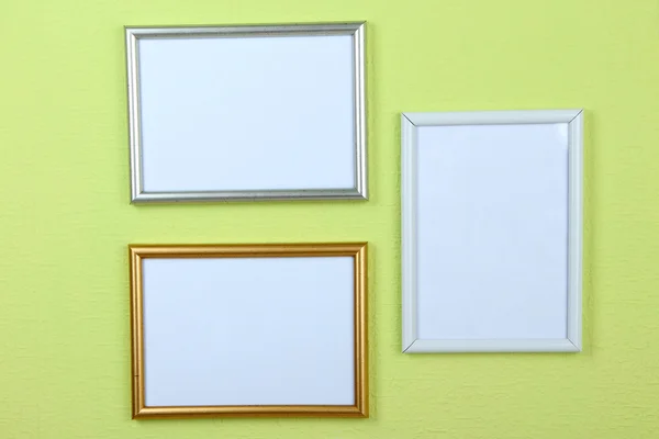 Photo frames on wall background — Stock Photo, Image