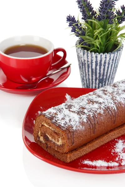 Sweet roll with cup of tea isolated on white — Stock Photo, Image